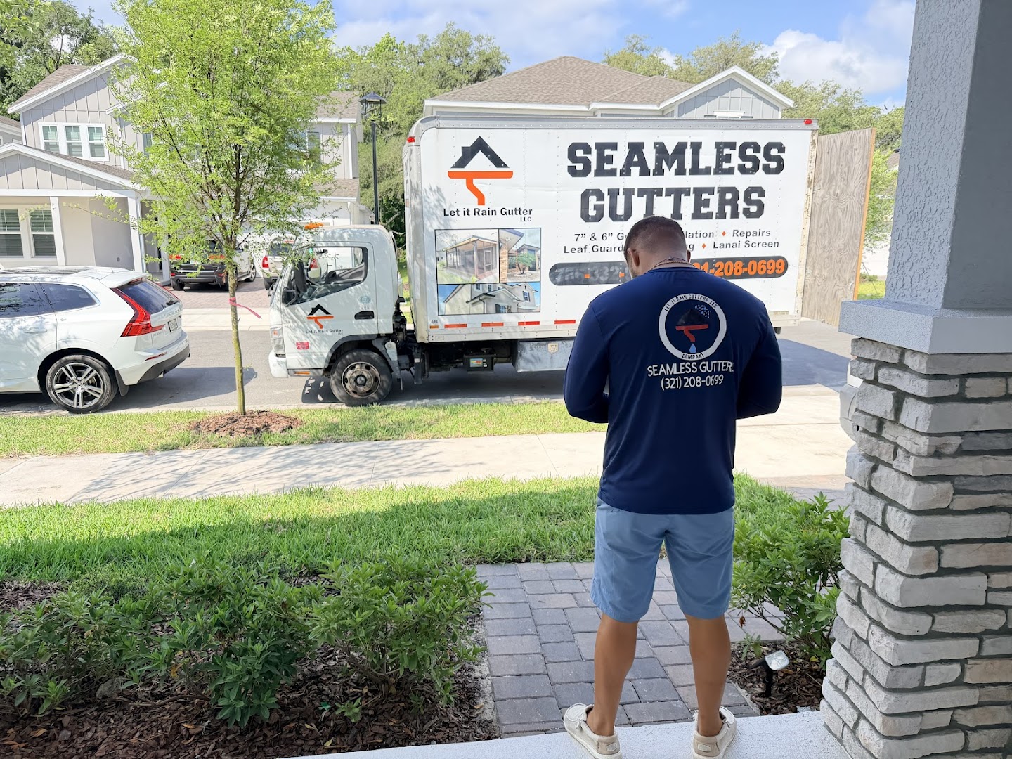 Let It Rain Seamless Gutters truck on a job, Deltona FL